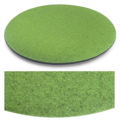 Das foto zeigt eine runde sitzauflage der firma discus. Die farbe der sitzauflage ist  hellgrün meliert.