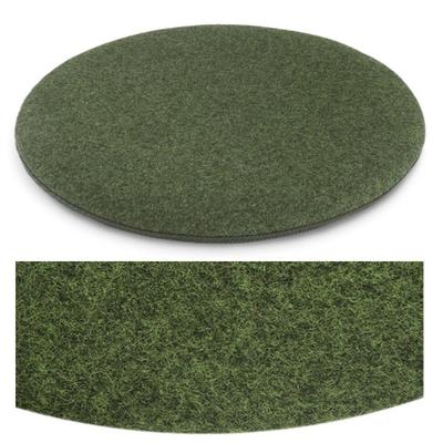 Das foto zeigt eine runde sitzauflage der firma discus. Die farbe der sitzauflage ist  grün meliert, leichter gelbstich.