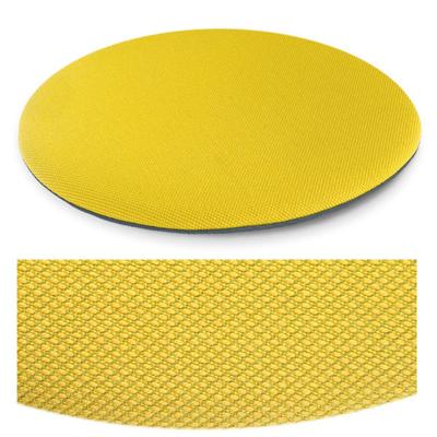 Das foto zeigt eine runde sitzauflage der firma discus. Die farbe der sitzauflage ist  gelb meliert.