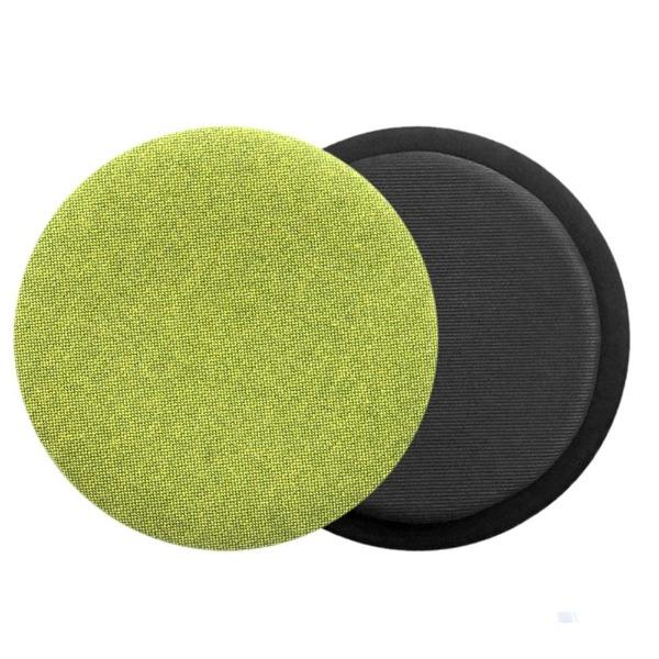 Das foto zeigt eine runde sitzauflage der firma discus. Dargestellt ist die vorderseite und die rueckseite des sitzkissens. Auf der rueckseite ist die schattenfuge erkennbar. Die farbe der sitzauflage ist gelb-gruen meliert. 
